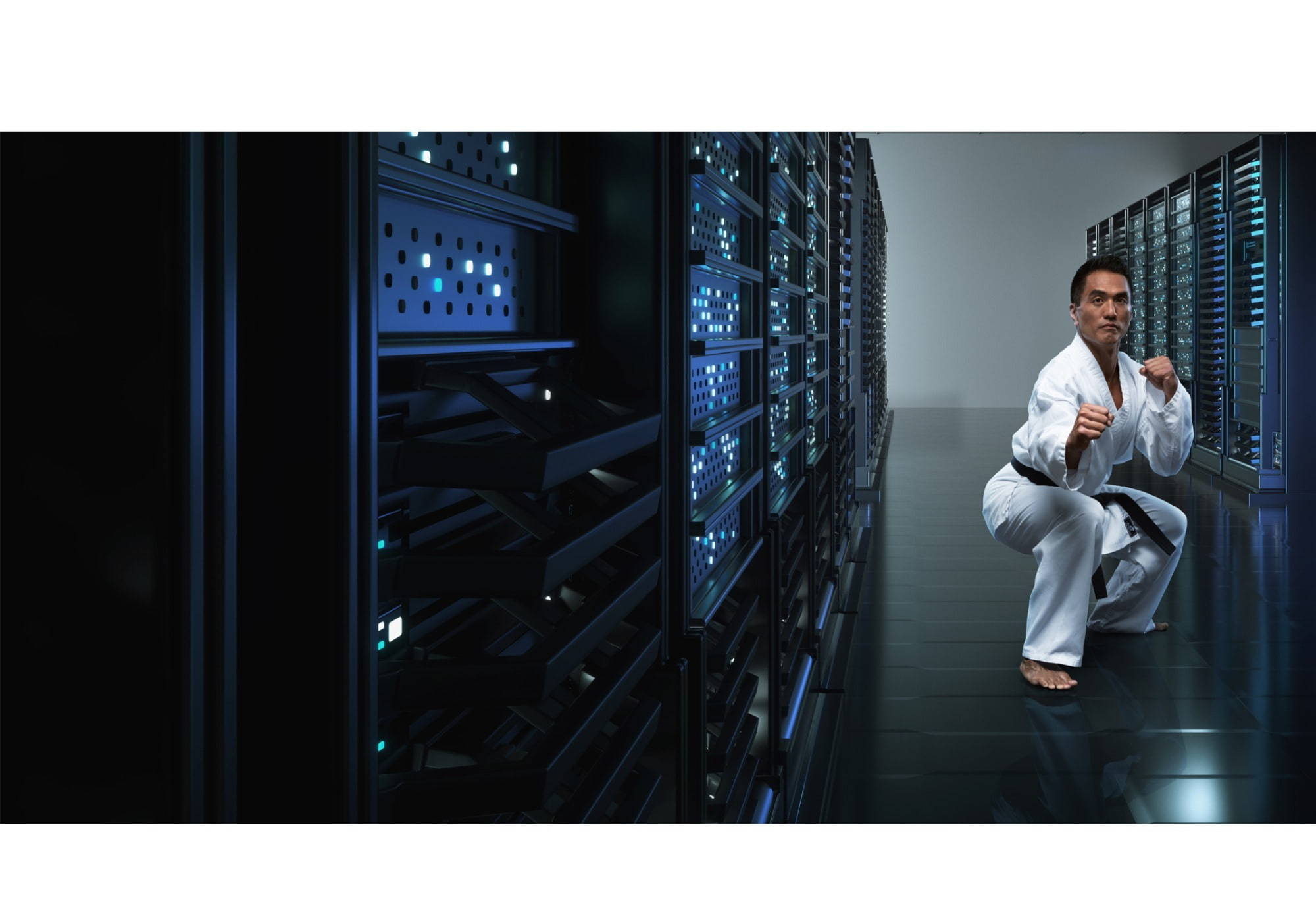 Man in karate stance in a server room | Employment Agencies