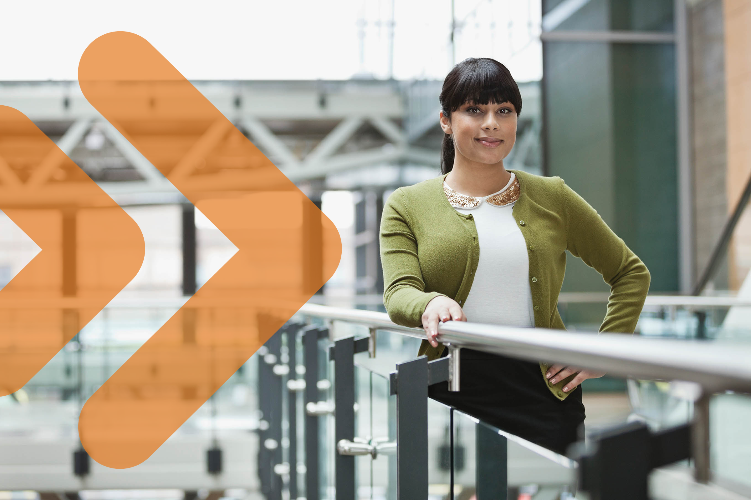 A woman standing on the IT recruitment agency's office balcony